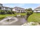 A view of a quaint backyard showcasing a tranquil pond with a fountain at 4060 Hartland St, Charleston, SC 29414
