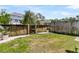 Grassy backyard featuring a wood fence and stone accents at 4060 Hartland St, Charleston, SC 29414
