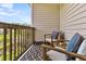 Cozy balcony with outdoor seating overlooking a tranquil pond at 4060 Hartland St, Charleston, SC 29414