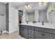 Bathroom with double sink vanity, stylish fixtures, offering plenty of counter space, and access to the closet at 4060 Hartland St, Charleston, SC 29414