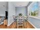 Cozy dining room features natural light from a large window and seating for four at 4060 Hartland St, Charleston, SC 29414