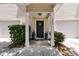 Charming home entrance with a black door and potted plants at 4060 Hartland St, Charleston, SC 29414