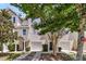 Two-story townhome with attached garage and well-maintained landscaping at 4060 Hartland St, Charleston, SC 29414