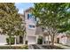 Charming townhome with a well-maintained lawn, inviting entrance, and attached one car garage at 4060 Hartland St, Charleston, SC 29414