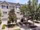 A tan, two-story townhouse featuring a welcoming entry and a private garage in a desirable neighborhood at 4060 Hartland St, Charleston, SC 29414