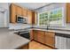 Bright kitchen with a large window over the sink and modern stainless steel appliances at 4060 Hartland St, Charleston, SC 29414