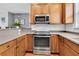 Well-equipped kitchen featuring stainless steel appliances, including a built-in microwave and a smooth cooktop at 4060 Hartland St, Charleston, SC 29414