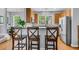 Eat-in kitchen featuring stainless steel appliances, warm wood cabinets, and bar stool seating at 4060 Hartland St, Charleston, SC 29414