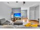Inviting living room with a large sofa, neutral decor, and seamless transition to the dining area at 4060 Hartland St, Charleston, SC 29414