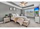 Serene main bedroom with a tray ceiling, ceiling fan, and an inviting color palette at 4060 Hartland St, Charleston, SC 29414
