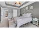 Relaxing main bedroom with tray ceilings, neutral walls, and a comfortable bed, creating a soothing retreat at 4060 Hartland St, Charleston, SC 29414