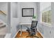 Home office with a modern desk, comfortable chair, and natural light from the window at 4060 Hartland St, Charleston, SC 29414