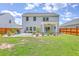 Exterior of home with stone patio and landscaped backyard at 4314 Cotton Flat Rd, Summerville, SC 29485