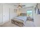 Stylish bedroom featuring a rustic bed frame, ample lighting, and a cozy ambiance for relaxation at 4314 Cotton Flat Rd, Summerville, SC 29485