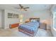 Cozy bedroom featuring a wooden bed frame, ample storage, and warm lighting for a relaxing ambiance at 4314 Cotton Flat Rd, Summerville, SC 29485