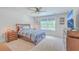 Comfortable bedroom with a plush bed, ample natural light, and a modern entertainment center at 4314 Cotton Flat Rd, Summerville, SC 29485