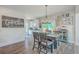 Inviting dining area with rustic wood table, stylish decor, and easy access to the outdoors, perfect for gatherings at 4314 Cotton Flat Rd, Summerville, SC 29485