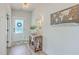 Bright foyer featuring wood floors, decorative table, and stylish decor, creating a welcoming entrance at 4314 Cotton Flat Rd, Summerville, SC 29485
