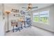 Bright home office featuring dual workstations, natural light, and views of the well-maintained backyard at 4314 Cotton Flat Rd, Summerville, SC 29485