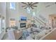 Bright and airy living room with high ceilings, large windows, and fireplace, perfect for relaxation and entertainment at 4314 Cotton Flat Rd, Summerville, SC 29485