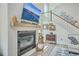 Modern living room featuring a sleek fireplace, staircase, and stylish decor, creating a cozy atmosphere at 4314 Cotton Flat Rd, Summerville, SC 29485