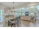 Spacious living and dining area with an open floor plan, modern decor, and plenty of natural light at 4314 Cotton Flat Rd, Summerville, SC 29485
