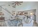 Open-concept living room with high ceilings, connecting seamlessly to the dining area and kitchen at 4314 Cotton Flat Rd, Summerville, SC 29485