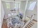 Aerial view of a spacious living room with a fireplace, cozy seating, and large windows, filled with natural light at 4314 Cotton Flat Rd, Summerville, SC 29485