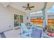 Comfortable patio features a ceiling fan, stylish rug, and sliding glass doors at 4314 Cotton Flat Rd, Summerville, SC 29485