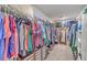 Well-organized walk-in closet with ample hanging space, shelving, and built-in drawers for storage at 4314 Cotton Flat Rd, Summerville, SC 29485
