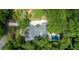 Breathtaking aerial view of a home featuring a private pool, lush landscaping, and spacious driveway at 441 Elfes Field Ln, Charleston, SC 29492