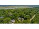 Stunning aerial view of homes surrounded by lush greenery and a scenic river in the background at 441 Elfes Field Ln, Charleston, SC 29492