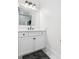 Bright bathroom with white vanity and cabinets, granite countertops, and modern fixtures, exuding a clean and elegant design at 441 Elfes Field Ln, Charleston, SC 29492
