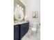 Charming powder room with granite counters, gold finishes, and designer wallpaper at 441 Elfes Field Ln, Charleston, SC 29492