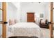 Cozy bedroom with a comfortable bed, an arm chair, and natural light at 441 Elfes Field Ln, Charleston, SC 29492