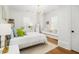Bright bedroom with neutral colors, a cozy daybed, and natural light from the windows at 441 Elfes Field Ln, Charleston, SC 29492