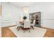 Bright dining area with a round table, cabinet, chandelier, and natural light at 441 Elfes Field Ln, Charleston, SC 29492
