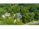Charming home nestled among trees with a well-manicured lawn and inviting walkway to the front porch at 441 Elfes Field Ln, Charleston, SC 29492