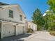 Two-story home featuring a large garage, well-maintained driveway, and attractive landscaping at 441 Elfes Field Ln, Charleston, SC 29492