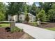 Beautiful home with a long driveway and landscaped yard, offering a sense of privacy and curb appeal at 441 Elfes Field Ln, Charleston, SC 29492