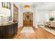 Elegant foyer with hardwood floors, a wooden front door, and stylish decor at 441 Elfes Field Ln, Charleston, SC 29492