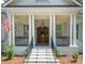Inviting front porch with elegant columns, showcasing the home's curb appeal and architectural details at 441 Elfes Field Ln, Charleston, SC 29492