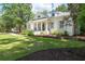 View of the exterior of the home and the landscaped front lawn and driveway at 441 Elfes Field Ln, Charleston, SC 29492