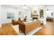 Spacious living room with tan leather couches, a fireplace, and lots of light at 441 Elfes Field Ln, Charleston, SC 29492