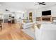 Spacious living room with open floor plan connecting the kitchen, dining, and sitting areas at 441 Elfes Field Ln, Charleston, SC 29492