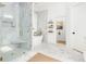 Bright bathroom featuring glass enclosed shower, standalone tub, and marble finishes at 441 Elfes Field Ln, Charleston, SC 29492