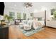 Spacious bedroom featuring hardwood floors, recessed lighting, seating, and natural light at 441 Elfes Field Ln, Charleston, SC 29492