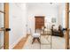 Well-lit office with a glass desk, wooden accents, and a comfortable chair at 441 Elfes Field Ln, Charleston, SC 29492