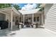Inviting outdoor living space with seating, dining, and outdoor kitchen, perfect for entertaining at 441 Elfes Field Ln, Charleston, SC 29492