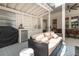 Well-appointed outdoor living space with seating, an outdoor kitchen, and a ceiling fan at 441 Elfes Field Ln, Charleston, SC 29492